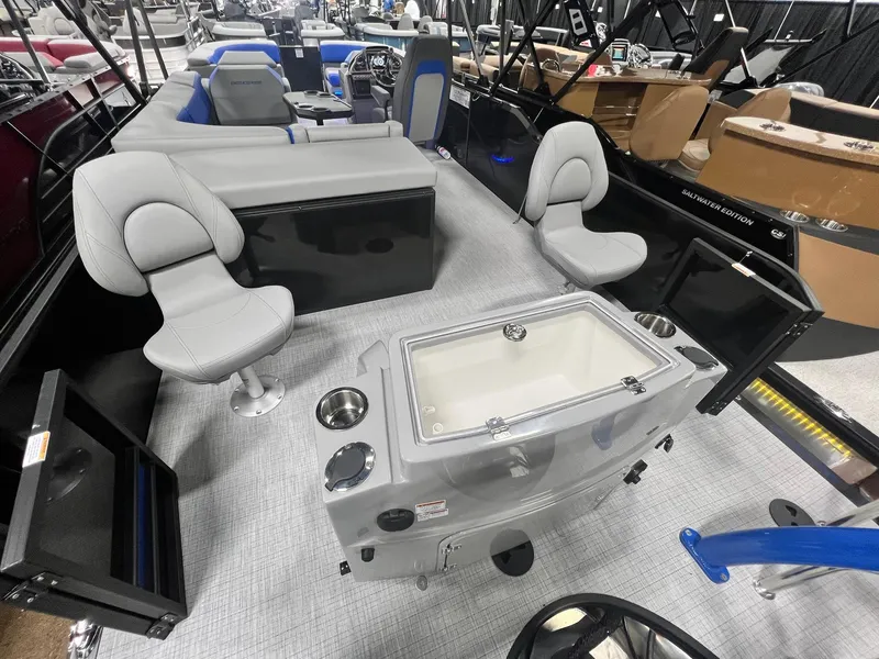 Slide: The Image of 2024 Berkshire 25RFC STS pontoon boat interior with seating and storage features. - 26
