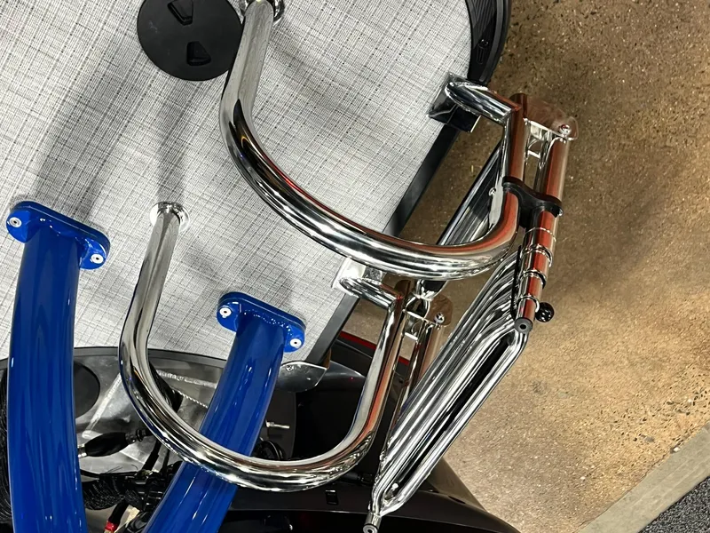 Slide: The Image of 2024 Berkshire 25RFC STS boat with chrome and blue accents, top view. - 27