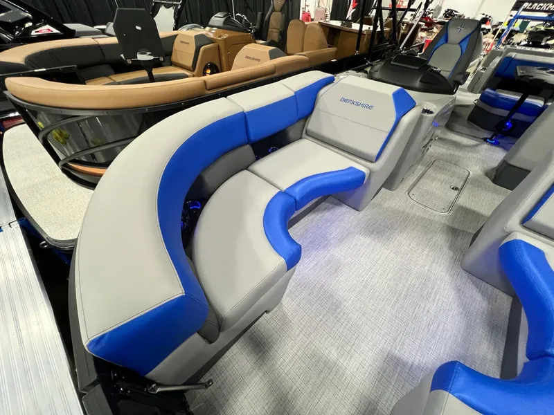 Slide: The Image of 2024 Berkshire 25RFC STS pontoon boat with blue and gray seating. - 29