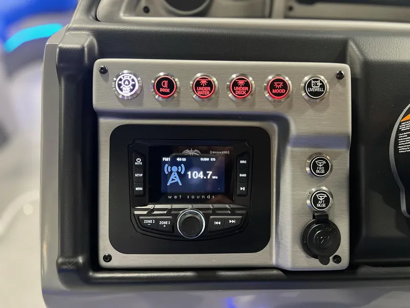 Slide: The Image of Control panel of 2024 Berkshire 25RFC STS boat with radio and various function buttons. - 32