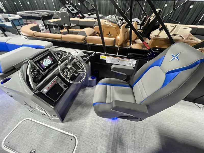 Slide: The Image of 2024 Berkshire 25RFC STS boat interior with captain's chair and control console. - 33