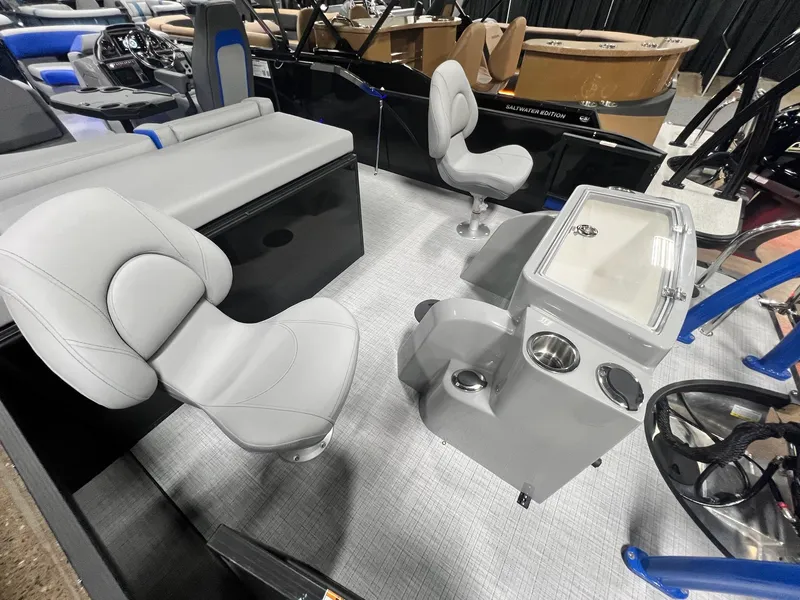 Slide: The Image of 2024 Berkshire 25RFC STS boat interior with gray seating and control console. - 37