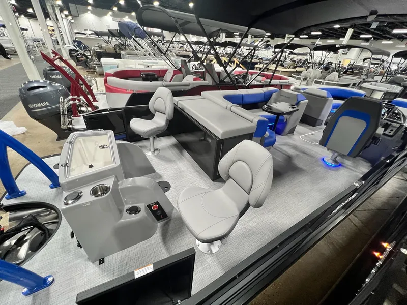 Slide: The Image of 2024 Berkshire 25RFC STS pontoon boat interior at a boat show. - 39
