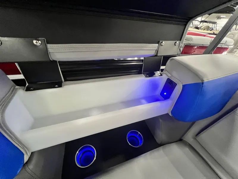 Slide: The Image of Interior of 2024 Berkshire 25RFC STS boat with blue LED cup holders and seating. - 40