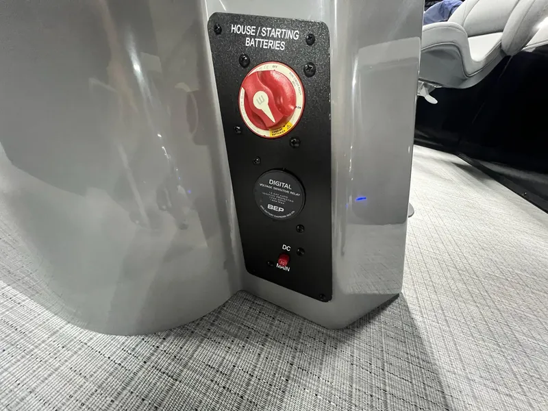 Slide: The Image of 2024 Berkshire 25RFC STS battery panel with digital voltage relay and main switch. - 44