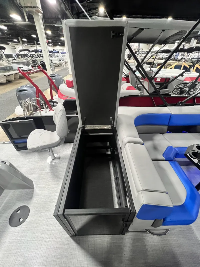 Slide: The Image of 2024 Berkshire 25RFC STS pontoon boat interior with open storage compartment and seating. - 46