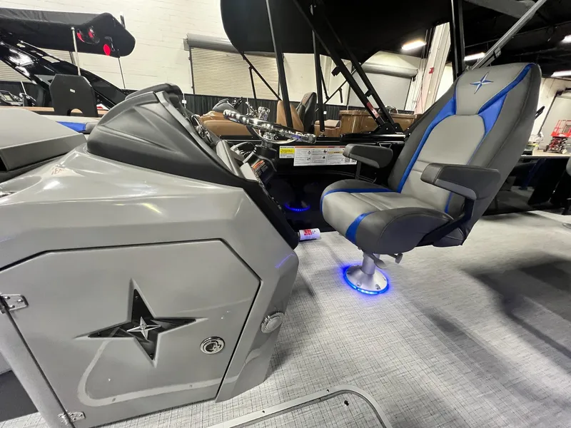 Slide: The Image of 2024 Berkshire 25RFC STS boat interior with modern helm and illuminated captain's chair. - 47