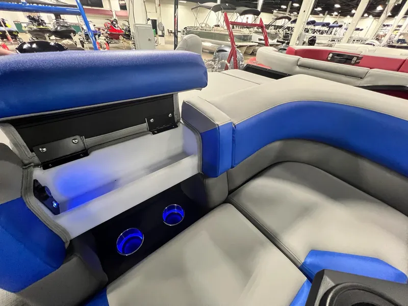 Slide: The Image of Interior seating of 2024 Berkshire 25RFC STS pontoon boat with blue LED cup holders. - 7
