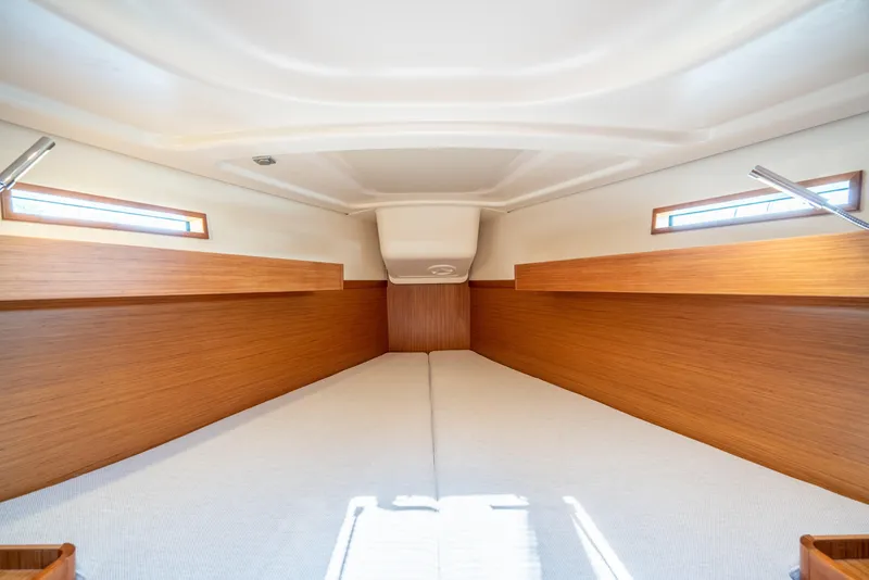 Slide: The Image of Interior cabin of 2016 Dehler 38 sailboat with wooden finish and twin windows. - 13