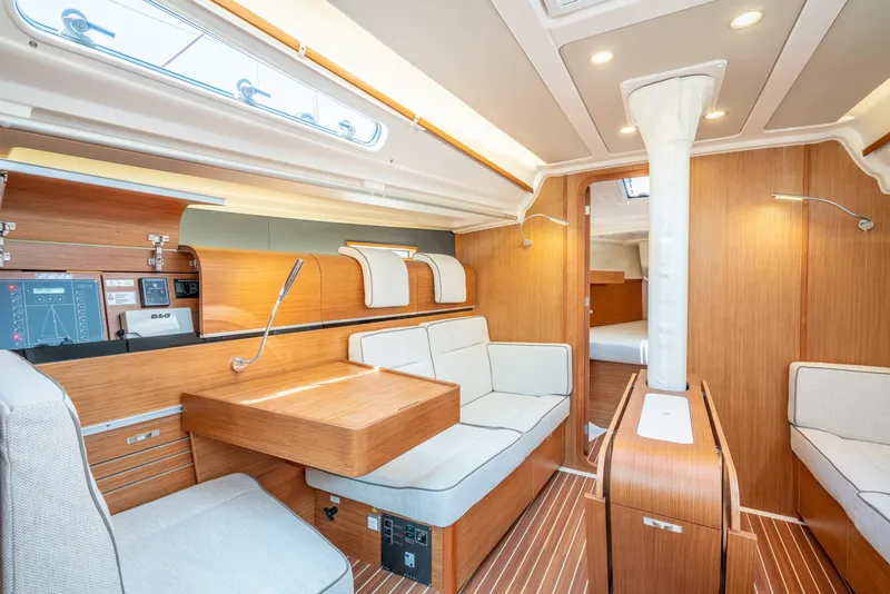 Slide: The Image of Interior of a 2016 Dehler 38 sailboat with modern wood finish and cozy seating. - 14