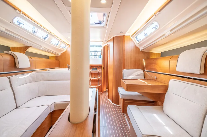 Slide: The Image of Interior of 2016 Dehler 38 sailboat with modern wood finish and cozy seating. - 15