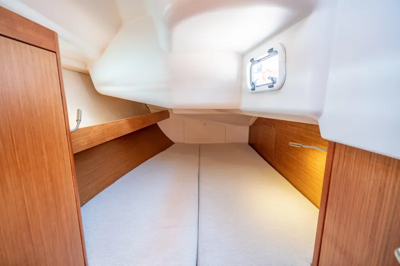 Slide: The Image of Interior cabin of 2016 Dehler 38 sailboat with wooden finish and cozy bedding. - 18