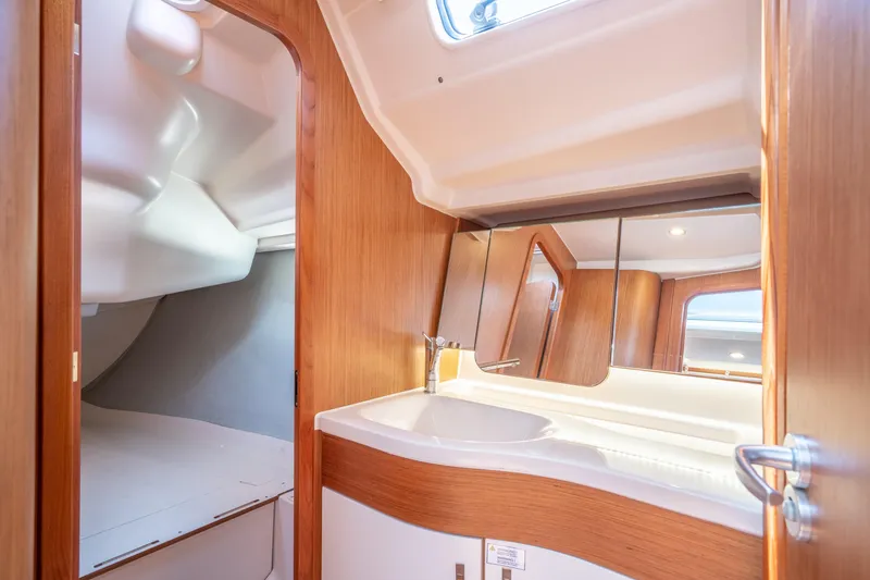 Slide: The Image of Interior of 2016 Dehler 38 sailboat with wooden cabinetry and modern fixtures. - 19