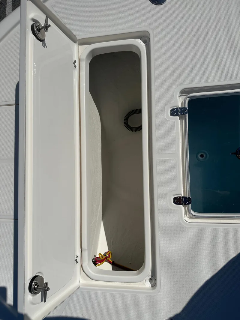 Slide: The Image of 2024 Sea Born FX25 Bay boat storage compartments. - 10