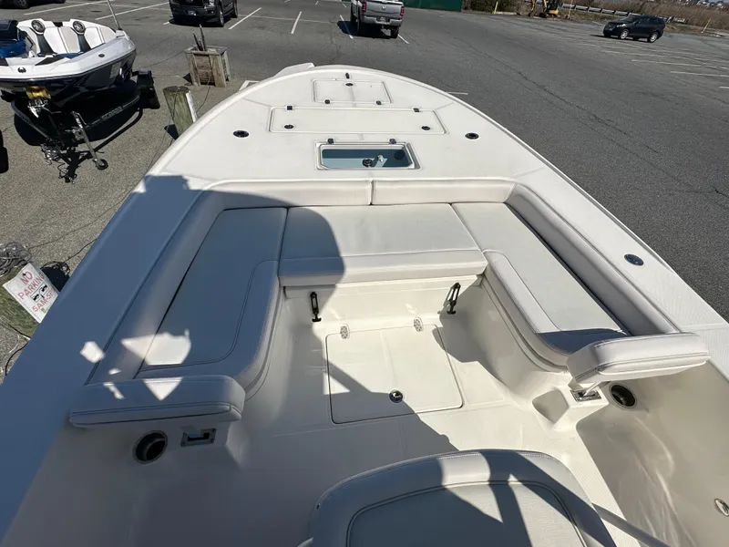 Slide: The Image of 2024 Sea Born FX25 Bay boat with spacious seating and storage compartments. - 14