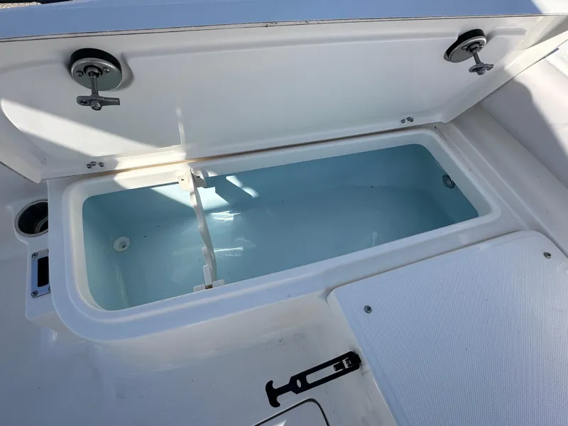 Slide: The Image of 2024 Sea Born FX25 Bay boat storage compartment open. - 16