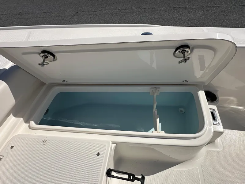 Slide: The Image of 2024 Sea Born FX25 Bay boat storage compartment open. - 18