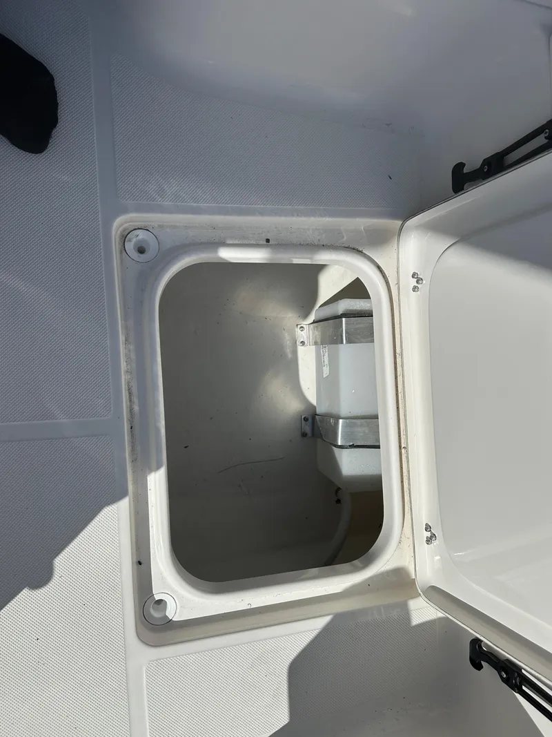 Slide: The Image of Open storage compartment on 2024 Sea Born FX25 Bay boat. - 20