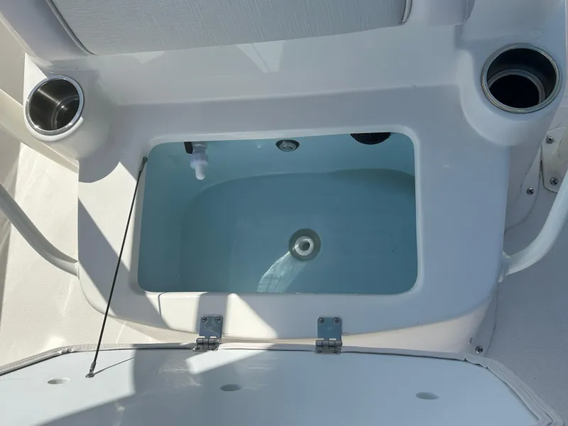 Slide: The Image of 2024 Sea Born FX25 Bay boat livewell with cup holders. - 22