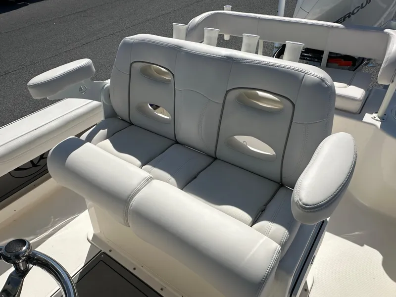 Slide: The Image of 2024 Sea Born FX25 Bay boat with cushioned seating and armrests. - 25