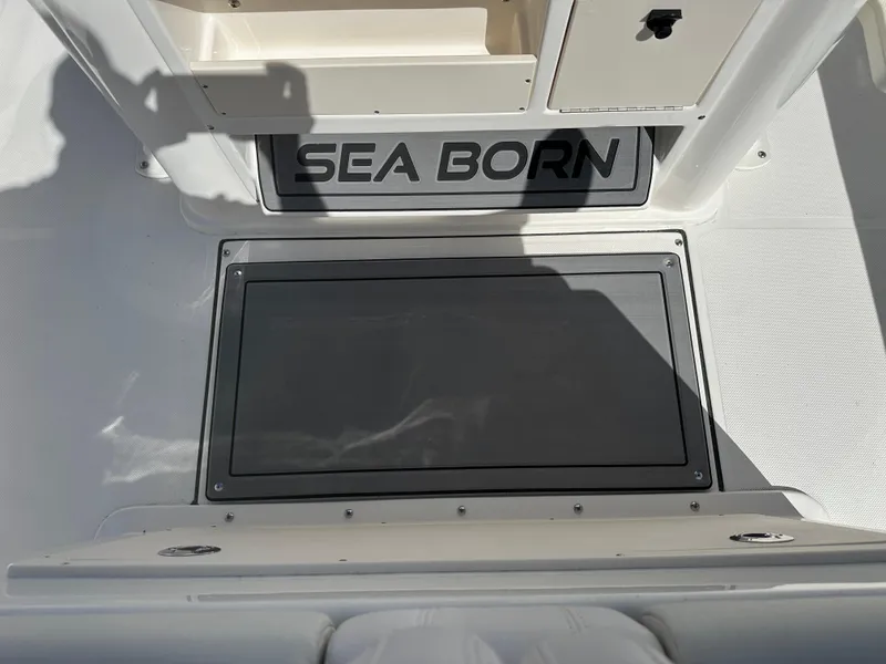 Slide: The Image of 2024 Sea Born FX25 Bay boat interior with storage compartments. - 30