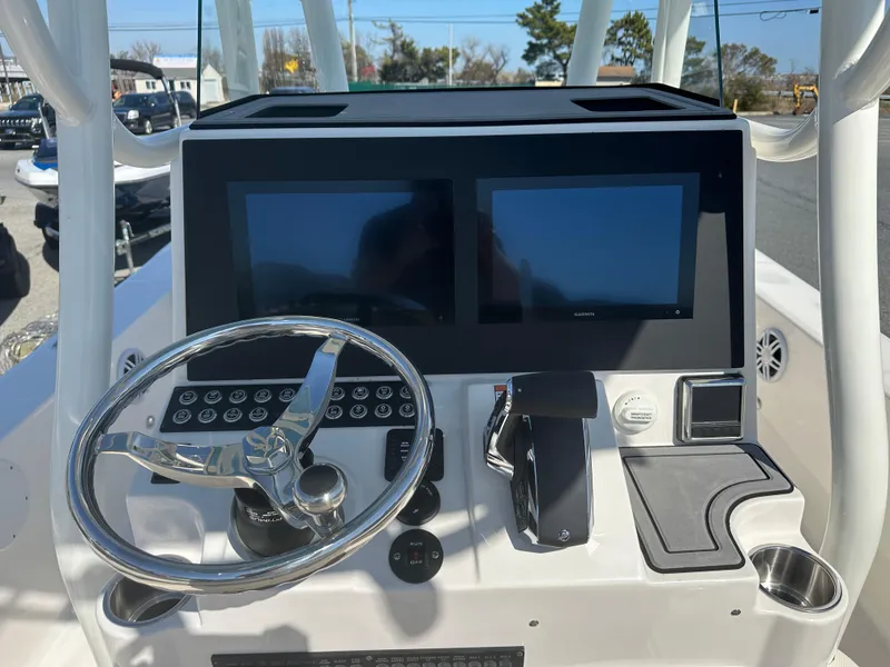 Slide: The Image of 2024 Sea Born FX25 Bay boat console with dual screens and steering wheel. - 31