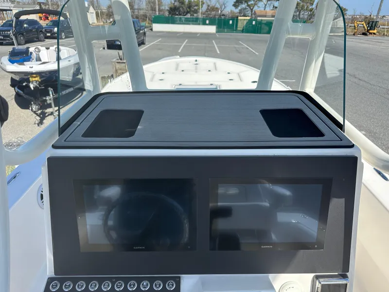 Slide: The Image of 2024 Sea Born FX25 Bay boat dashboard with dual screens and control panel. - 33