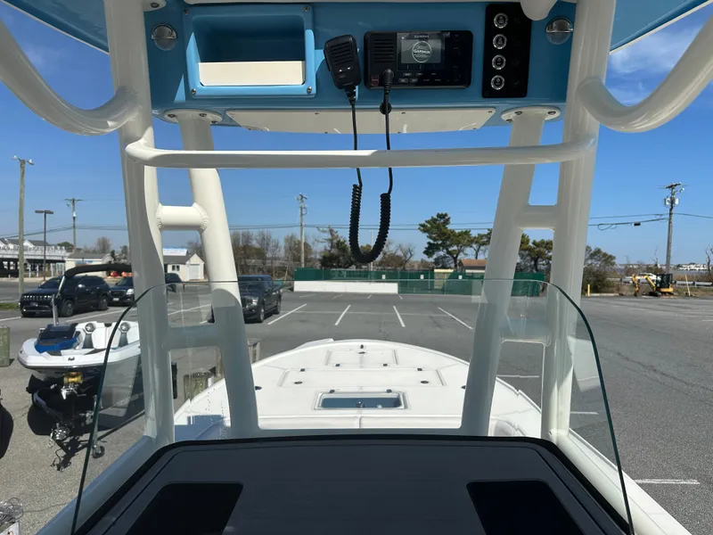 Slide: The Image of 2024 Sea Born FX25 Bay boat console with electronics and clear windshield. - 36