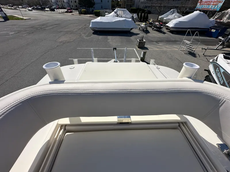 Slide: The Image of 2024 Sea Born FX25 Bay boat, view from the helm seat, docked in a marina. - 42