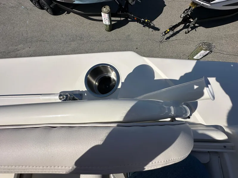 Slide: The Image of 2024 Sea Born FX25 Bay boat interior with cup holder and seating. - 44