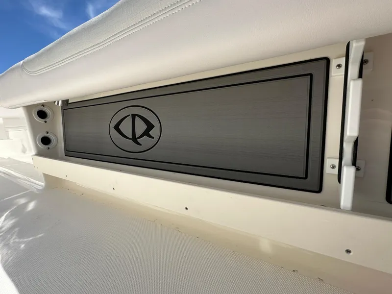 Slide: The Image of 2024 Sea Born FX25 Bay boat interior detail with storage compartment. - 48