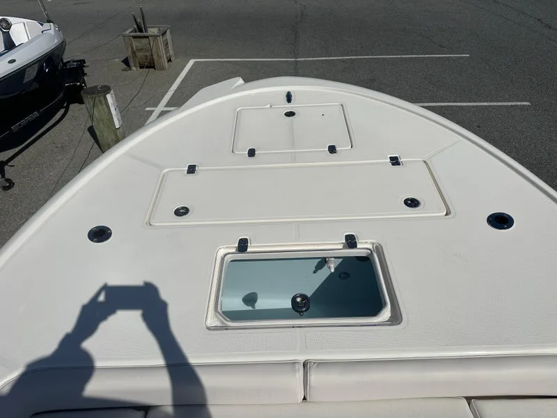 Slide: The Image of 2024 Sea Born FX25 Bay boat deck with storage compartments and livewell. - 8