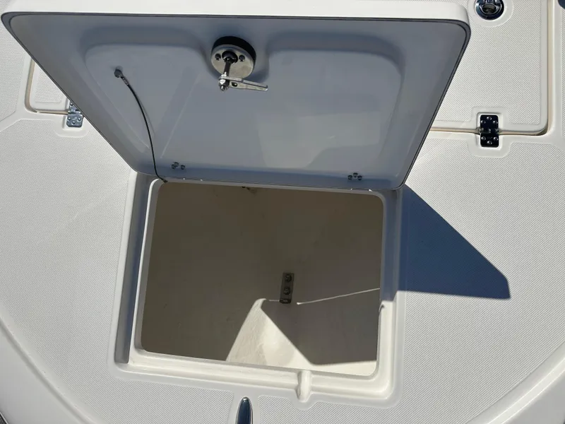 Slide: The Image of 2024 Sea Born FX25 Bay boat storage compartment with open hatch. - 9