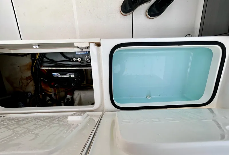 Slide: The Image of 2024 Sea Born LX 22 LE boat compartments, showcasing storage and livewell features. - 13