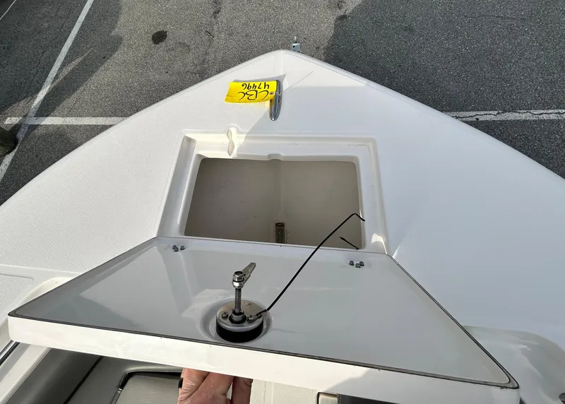 Slide: The Image of 2024 Sea Born LX 22 LE boat with open storage compartment on deck. - 16