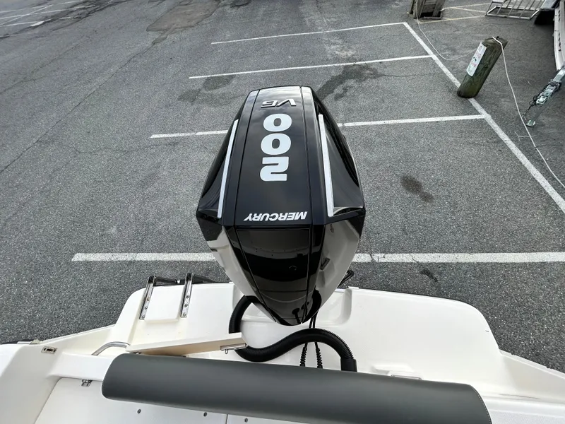 Slide: The Image of 2024 Sea Born LX 22 LE with Mercury 200 HP outboard engine in parking lot. - 19