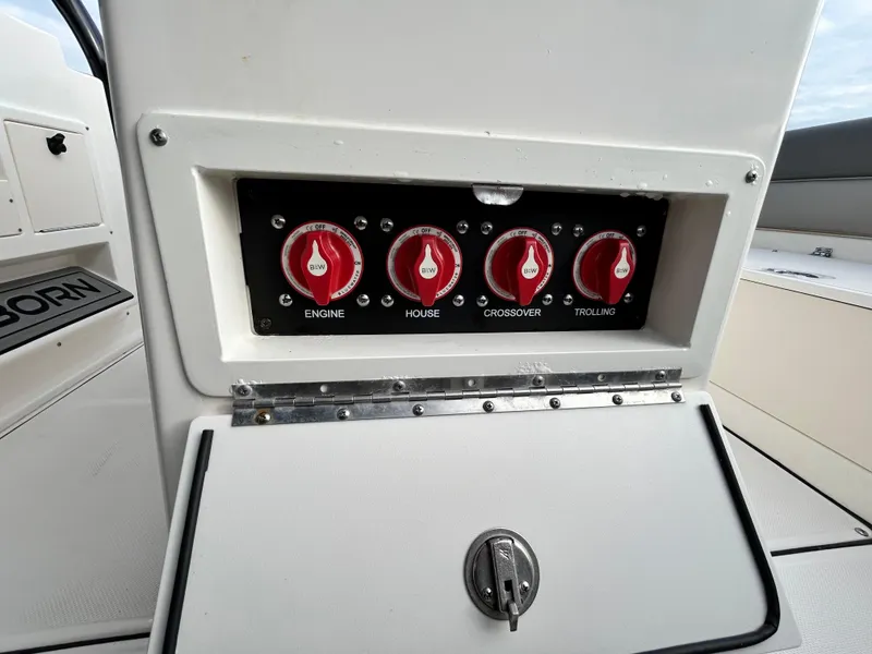 Slide: The Image of Control panel on 2024 Sea Born LX 22 LE boat with labeled switches. - 21