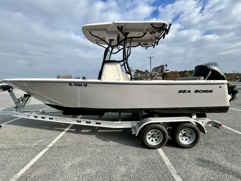 Slide: The Image of 2024 Sea Born LX 22 LE boat on trailer in parking lot. - 4