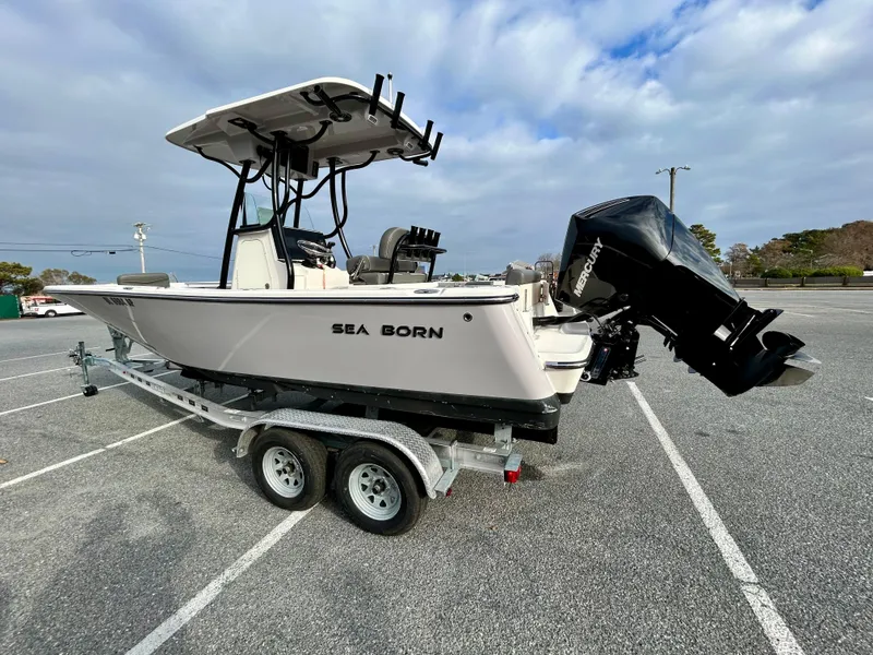 Slide: The Image of 2024 Sea Born LX 22 LE boat on trailer in parking lot. - 5