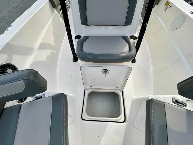 Slide: The Image of 2024 Sea Born LX 22 LE boat interior with seating and storage compartment. - 6