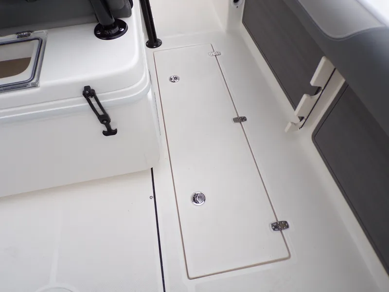 Slide: The Image of 2024 Sea Born SX 239 boat deck with storage compartments. - 20