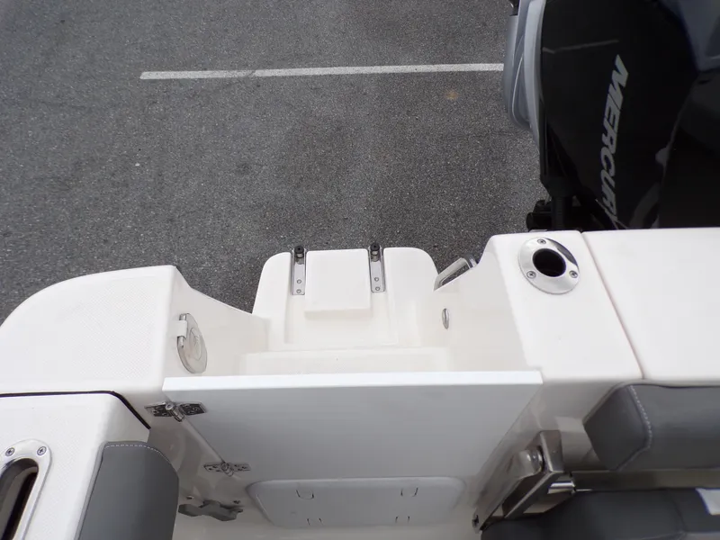 Slide: The Image of 2024 Sea Born SX 239 boat stern with swim platform and Mercury outboard motor. - 22