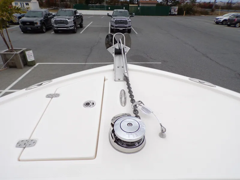 Slide: The Image of 2024 Sea Born SX 239 boat bow with anchor and chain in parking lot. - 9