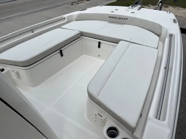 Slide: The Image of 2024 World Cat 235 CC boat interior with white cushioned seating. - 3