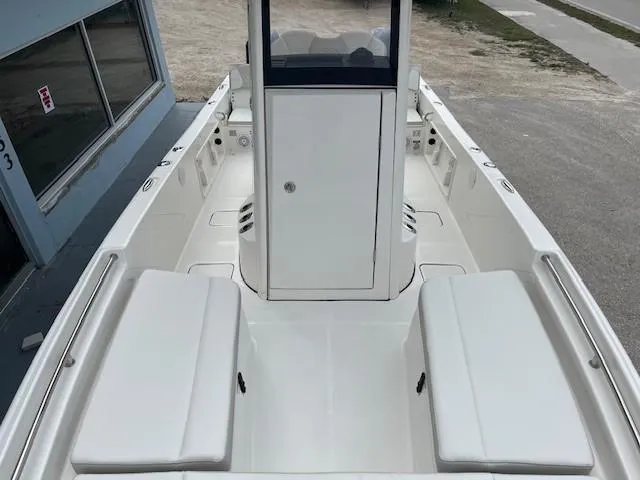Slide: The Image of 2024 World Cat 235 CC boat interior with white seating and center console. - 4