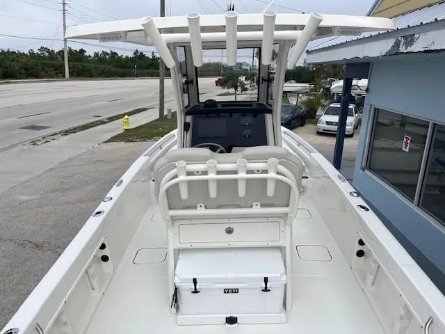 Slide: The Image of 2024 World Cat 235 CC center console boat with T-top and Yeti cooler. - 8