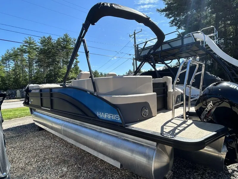 Slide: The Image of 2024 Harris Cruiser 230 pontoon boat with sleek design and modern features. - 1
