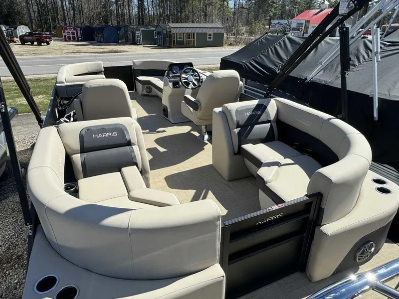 Slide: The Image of 2024 Harris Cruiser 230 pontoon boat with spacious seating and modern design. - 10