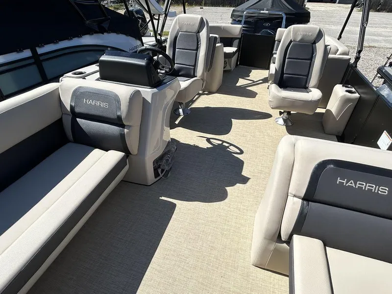 Slide: The Image of 2024 Harris Cruiser 230 pontoon boat interior with plush seating and modern design. - 12
