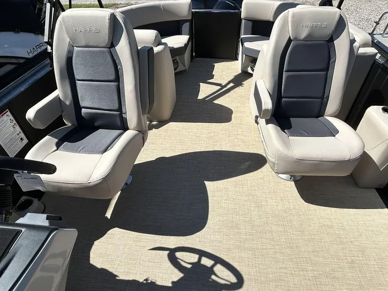 Slide: The Image of 2024 Harris Cruiser 230 interior with plush seating and spacious layout. - 14